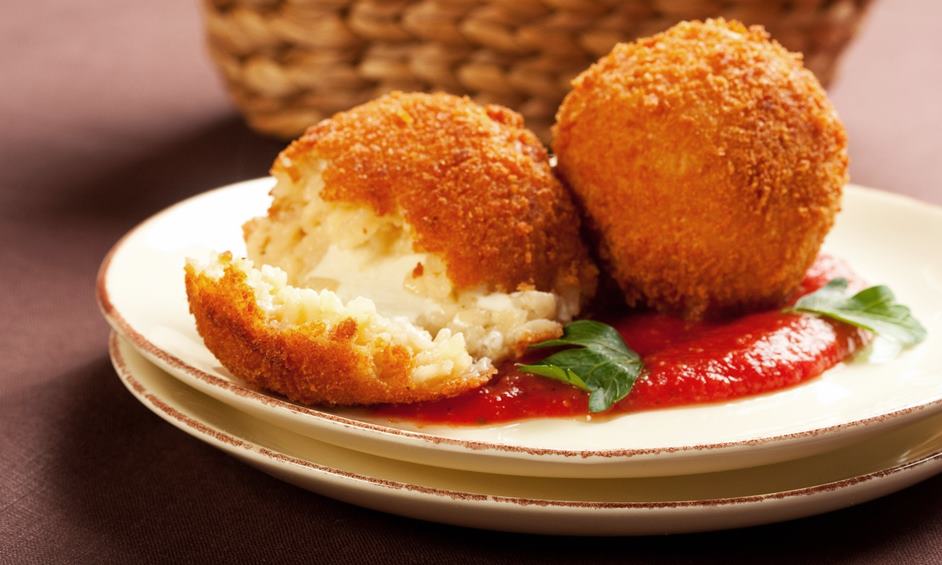 Deep fried balls of arborio rice stuffed with mozzarella cheese