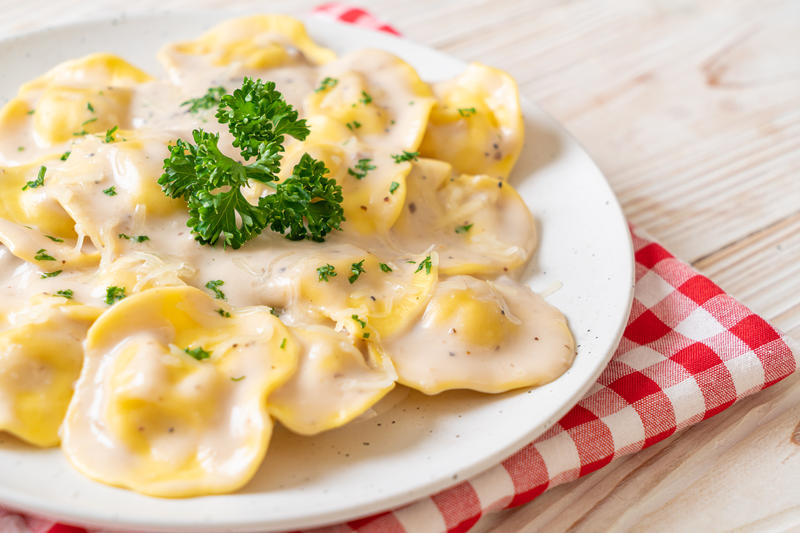 ravioli pasta with mushroom cream sauce and cheese - Italian food style